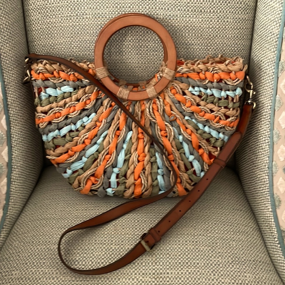 Patricia Nash convertible half circle tote.